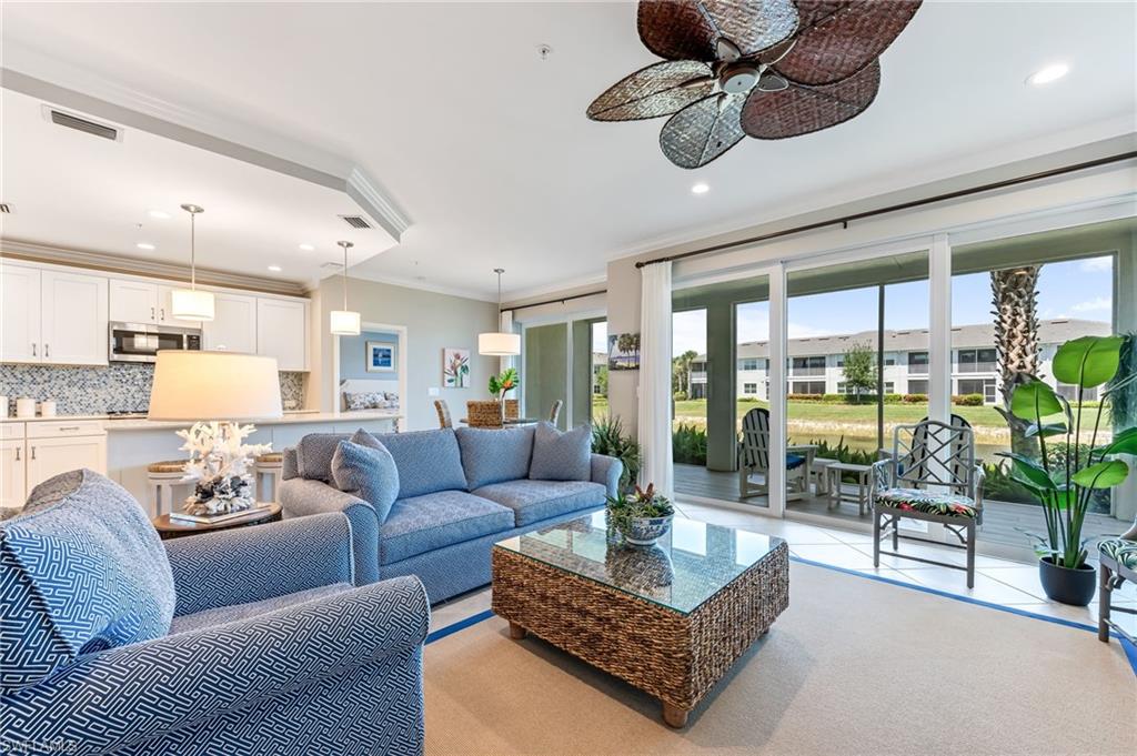 6948 Avalon Circle, Unit 604 Naples, FL 34112 - Photo 7 of 33 Living area featuring recessed lighting, visible vents, ornamental molding, and a ceiling fan