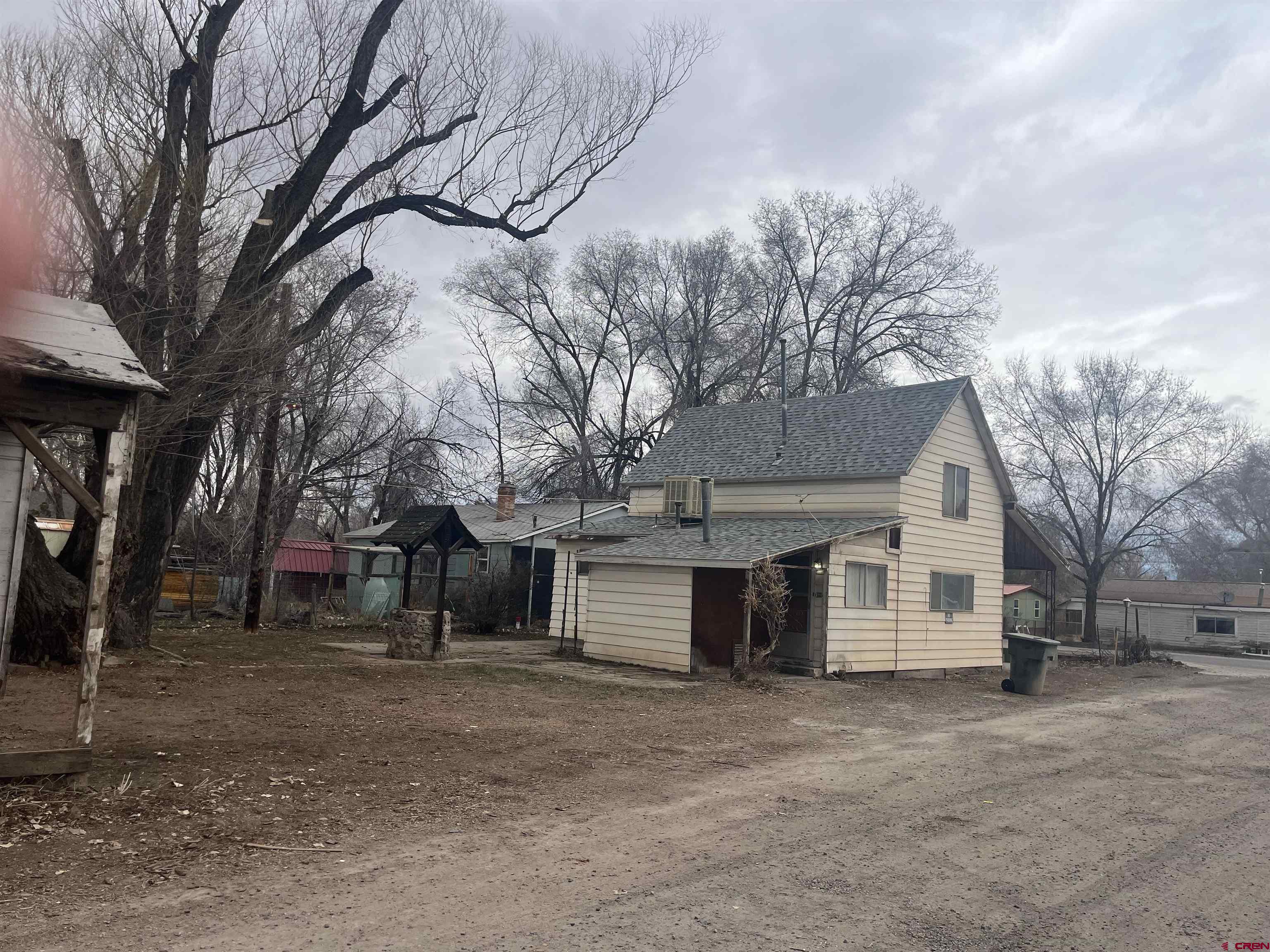 200 Southwest 5th Street Olathe, CO 81425 - Photo 2 of 3 a view of a white house with a large tree