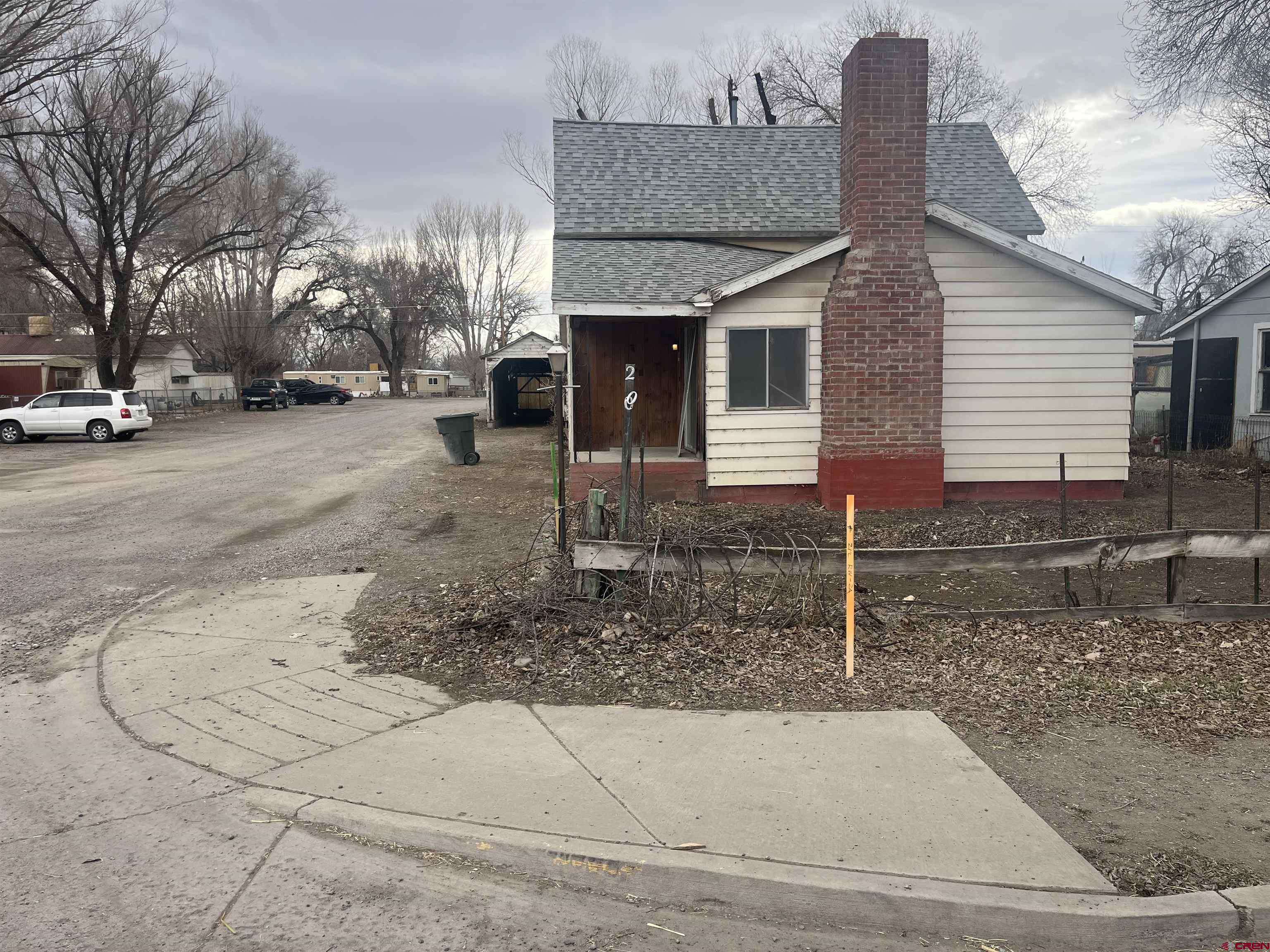200 Southwest 5th Street Olathe, CO 81425 - Photo 3 of 3 a view of a house with a yard