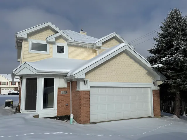 a view of a house with garage