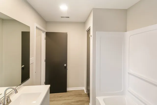 a view of an empty room with a window