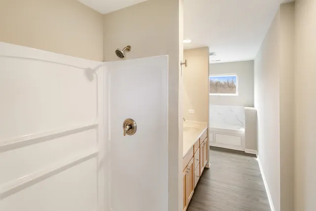 a bathroom with a bathtub and a sink