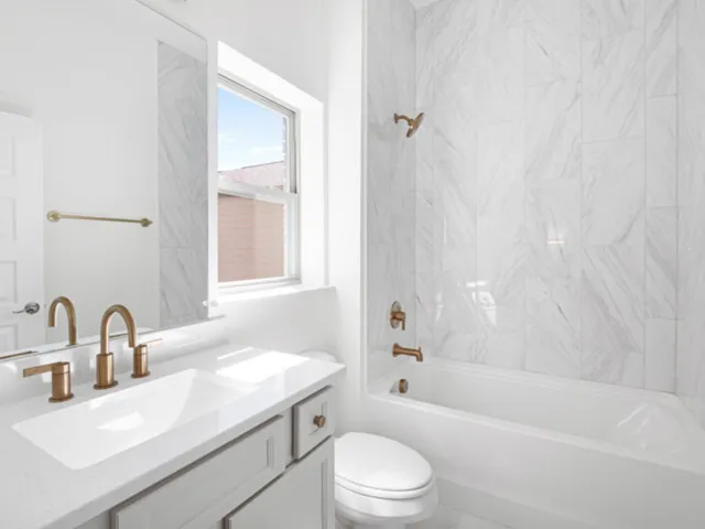 a bathroom with a sink toilet and bathtub