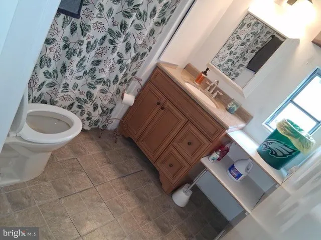 a bathroom with a toilet and a sink