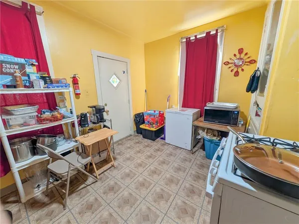 a living room with furniture a rug and a wall painting