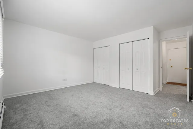 a view of an empty room and entryway