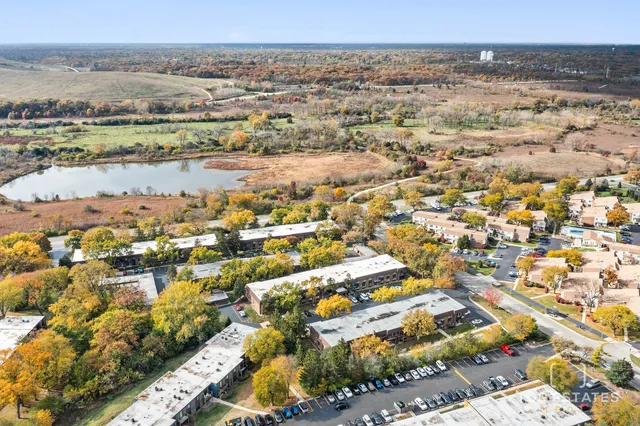 an aerial view of residential building and lake view