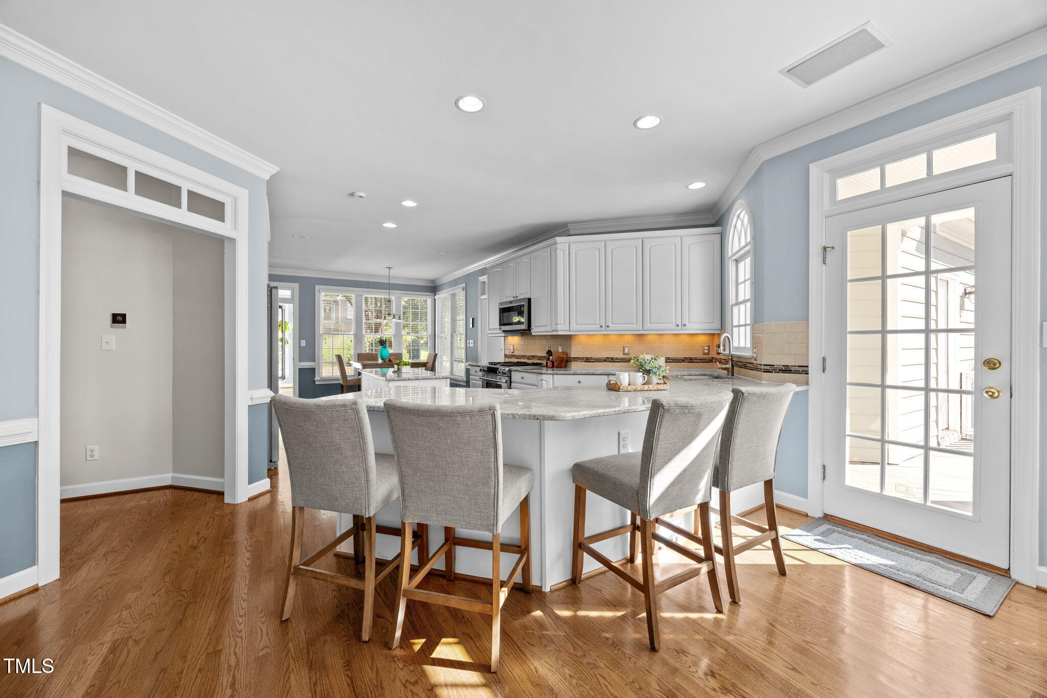 8001 Kukui Court Raleigh, NC 27613 - Photo 14 of 51 a view of a dining room with furniture and wooden floor