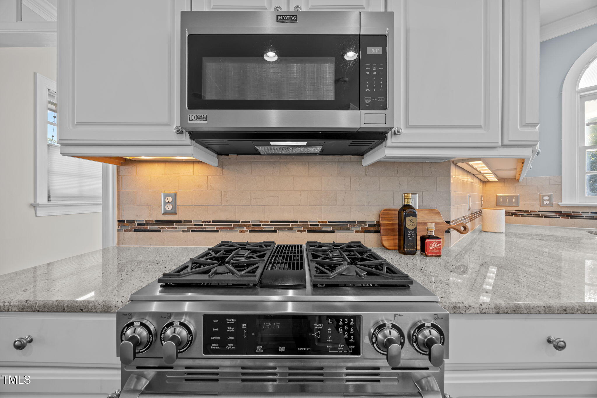 8001 Kukui Court Raleigh, NC 27613 - Photo 16 of 51 a stove top oven sitting inside of a kitchen