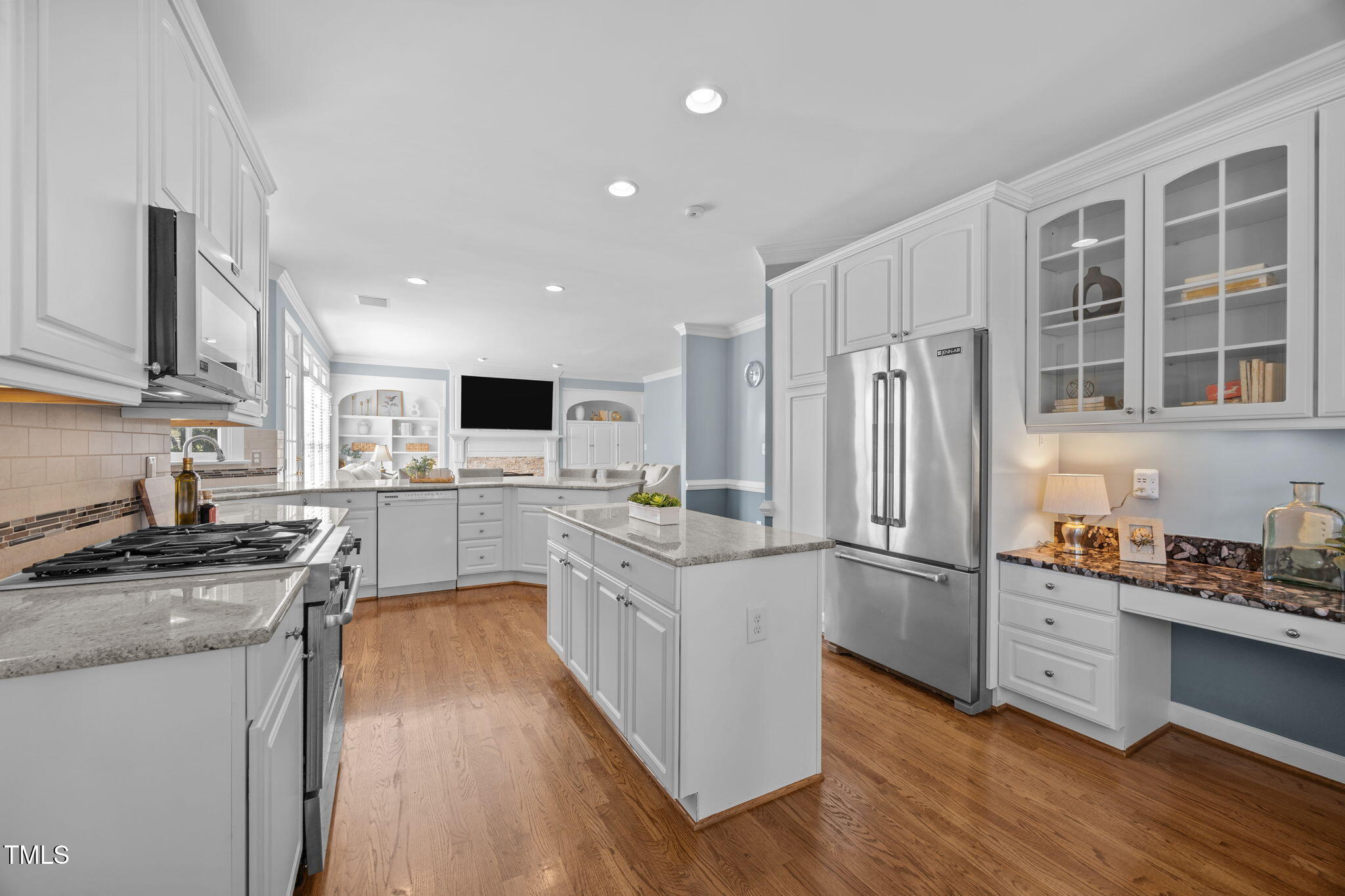8001 Kukui Court Raleigh, NC 27613 - Photo 17 of 51 a kitchen with stainless steel appliances granite countertop a refrigerator stove and sink