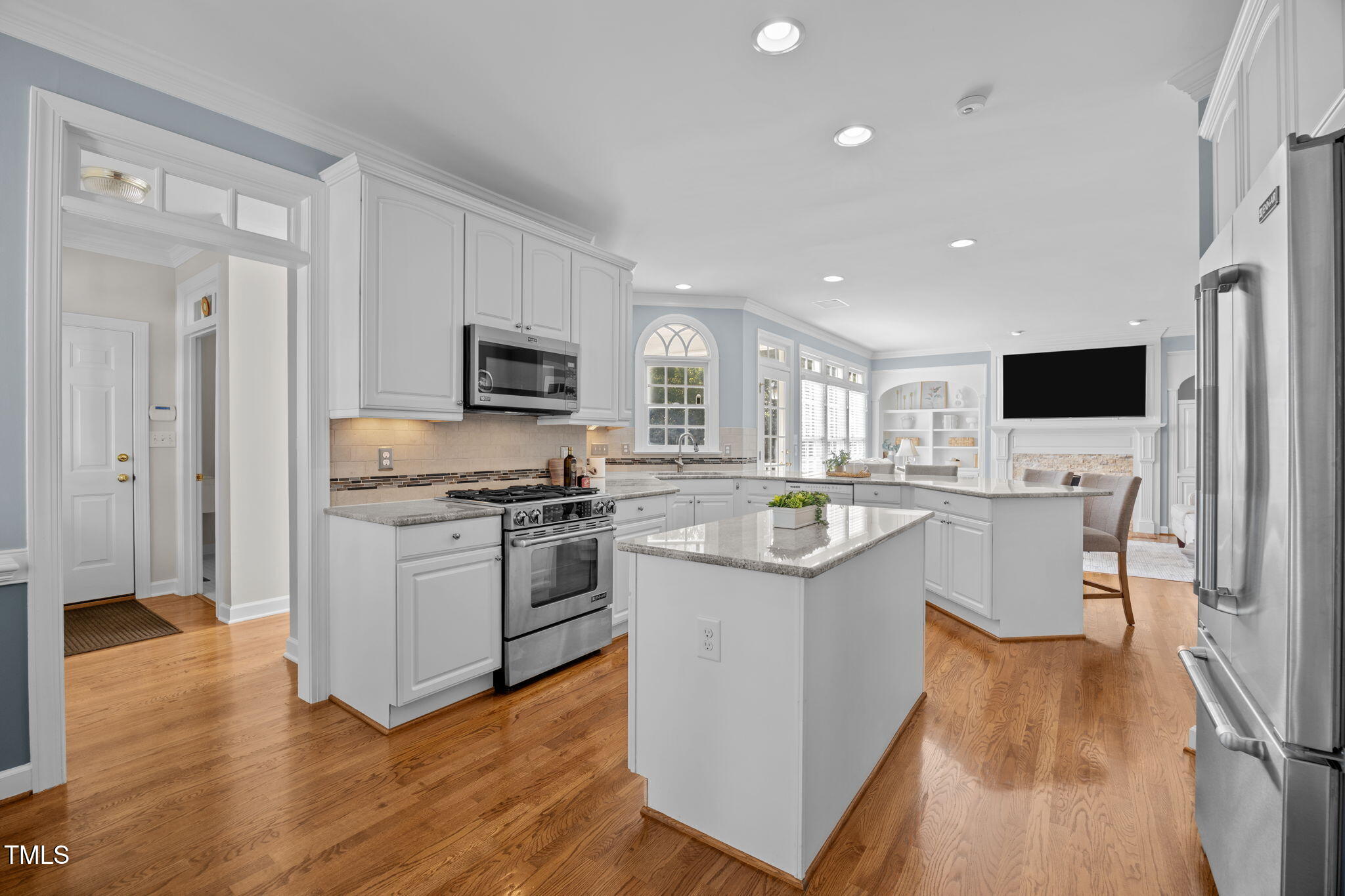 8001 Kukui Court Raleigh, NC 27613 - Photo 19 of 51 a kitchen with a sink cabinets and wooden floor