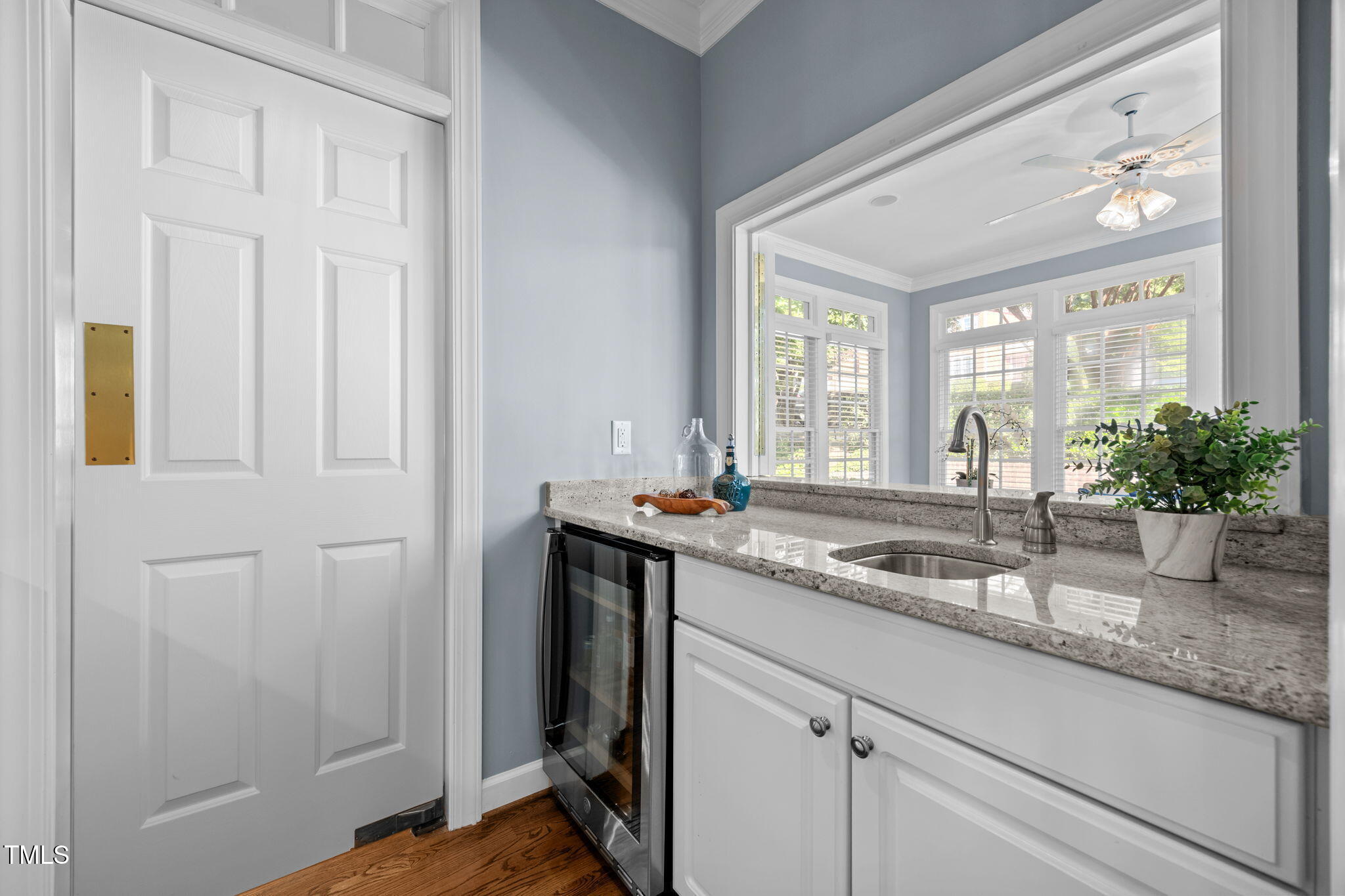 8001 Kukui Court Raleigh, NC 27613 - Photo 24 of 51 a bathroom with a granite countertop sink and a mirror