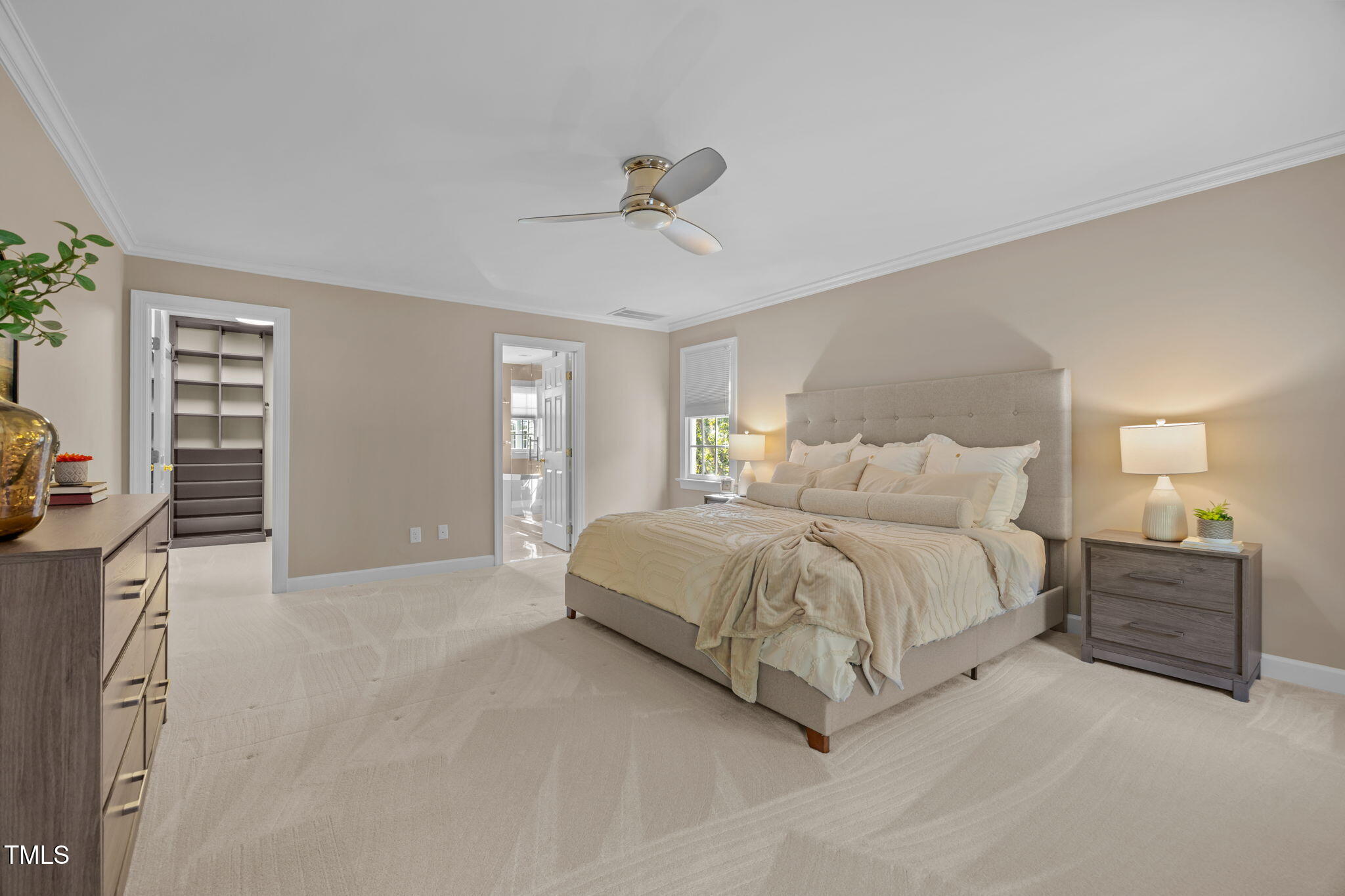 8001 Kukui Court Raleigh, NC 27613 - Photo 30 of 51 a spacious bedroom with a bed and a lamp
