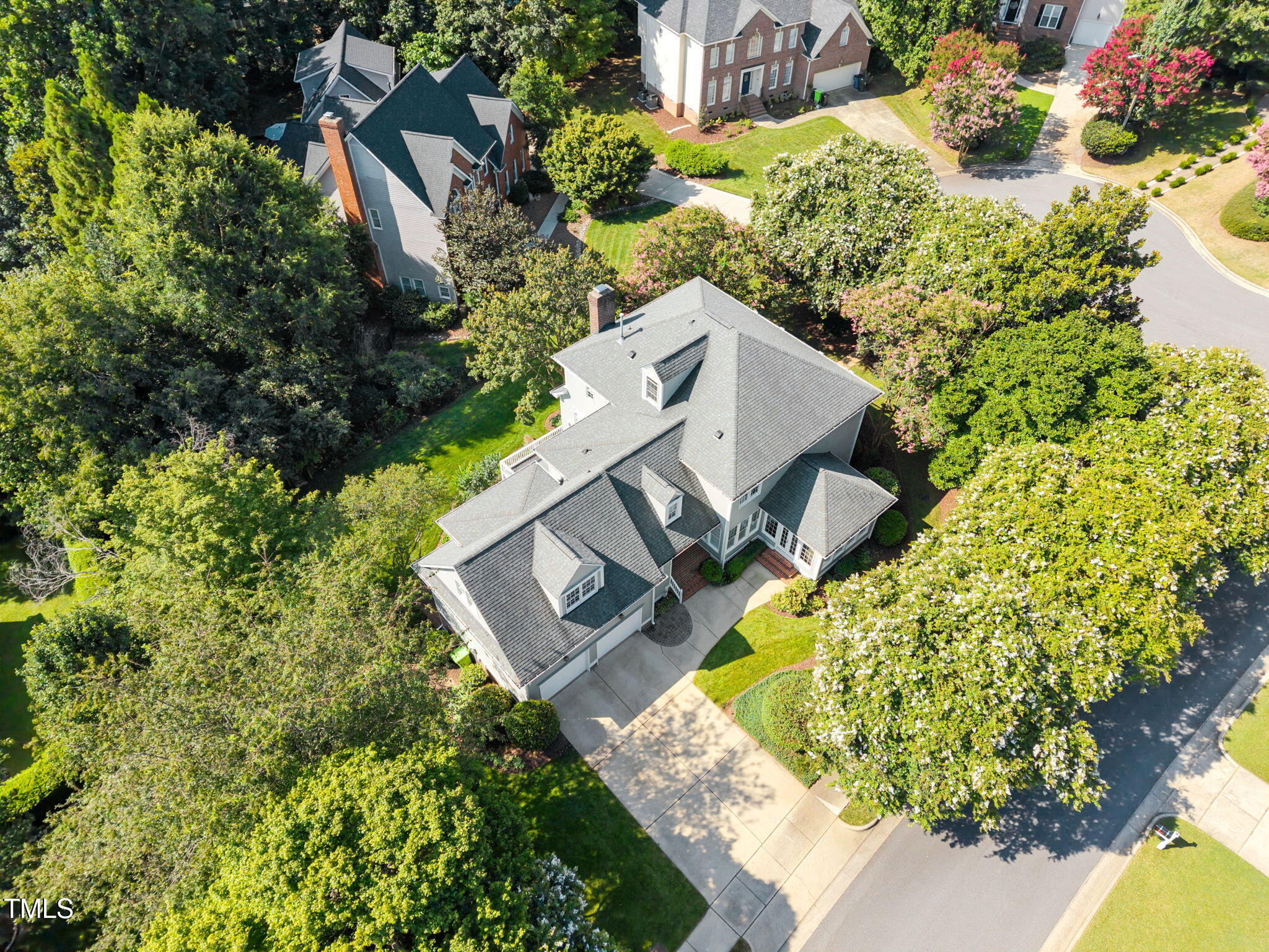 8001 Kukui Court Raleigh, NC 27613 - Photo 48 of 51 an aerial view of a house with a yard and swimming pool