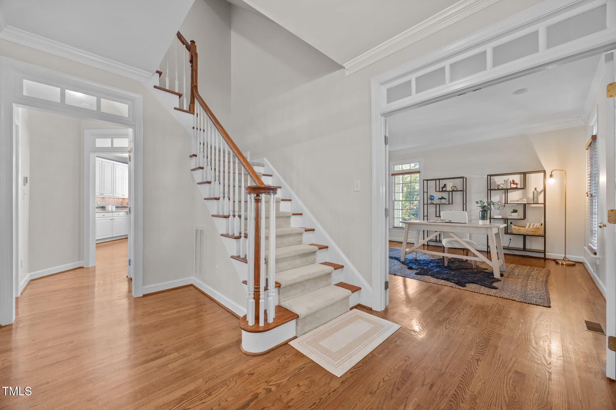 8001 Kukui Court Raleigh, NC 27613 - Photo 5 of 51 a view of entryway and hall with wooden floor