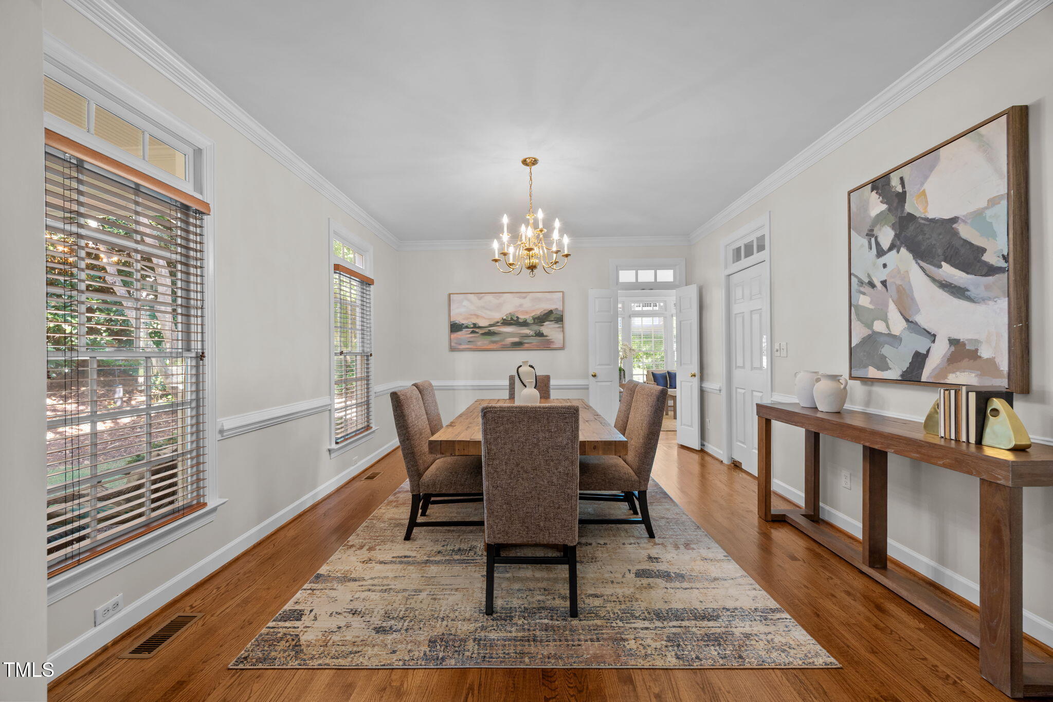 8001 Kukui Court Raleigh, NC 27613 - Photo 8 of 51 a view of a dining room with furniture window and wooden floor