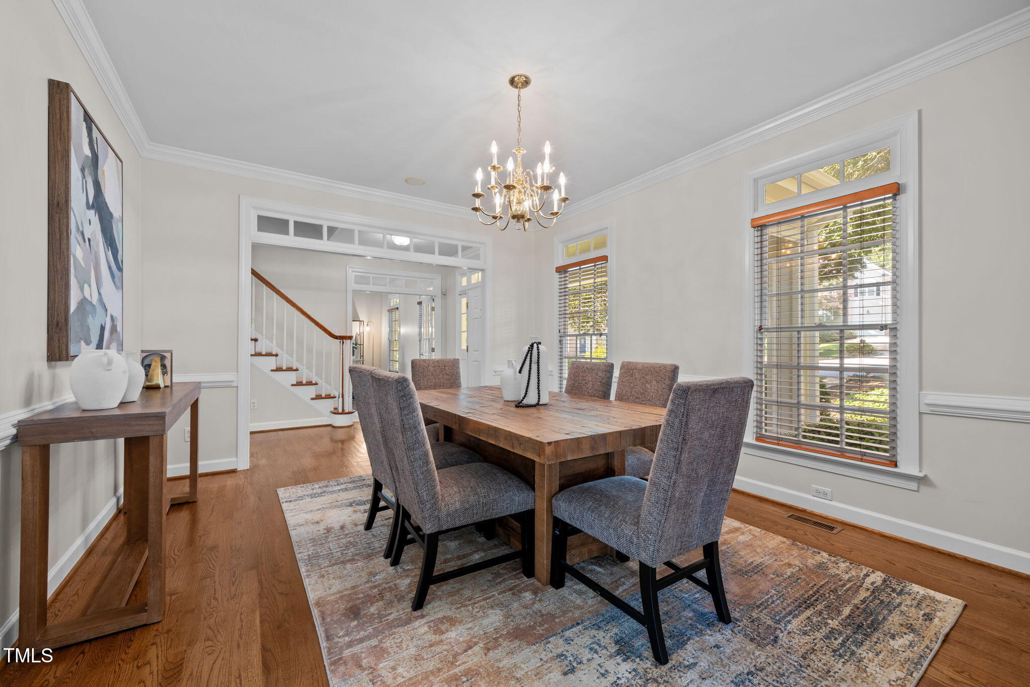 8001 Kukui Court Raleigh, NC 27613 - Photo 9 of 51 a view of a dining room with furniture window and wooden floor