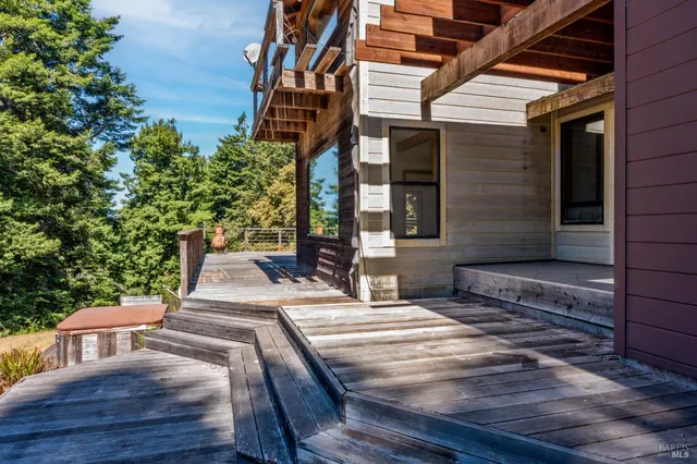 a view of a lake in between two of trees