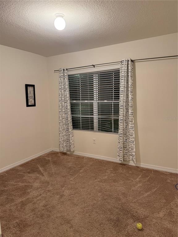 1895 Hickory Bluff Road Kissimmee, FL 34744 - Photo 11 of 17 a view of an empty room with a window