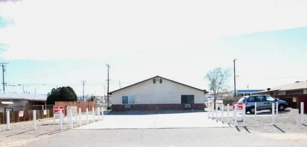 a front view of a house with a outdoor space