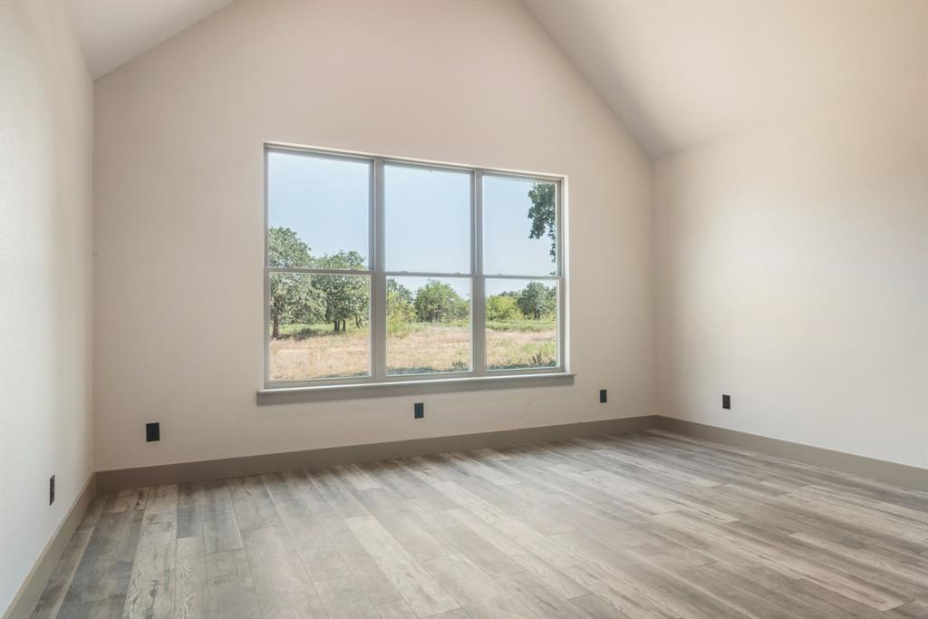 233 Jayden Lane Loving, TX 76460 - Photo 13 of 40 an empty room with a window