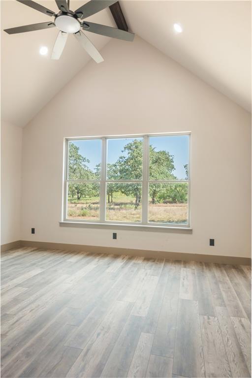 233 Jayden Lane Loving, TX 76460 - Photo 14 of 40 an empty room with wooden floor and windows