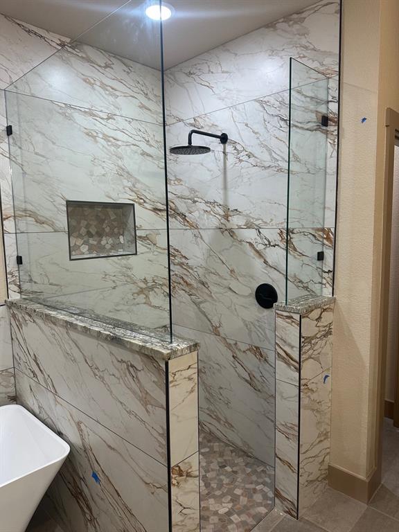 233 Jayden Lane Loving, TX 76460 - Photo 16 of 40 a bathroom with a shower and a sink