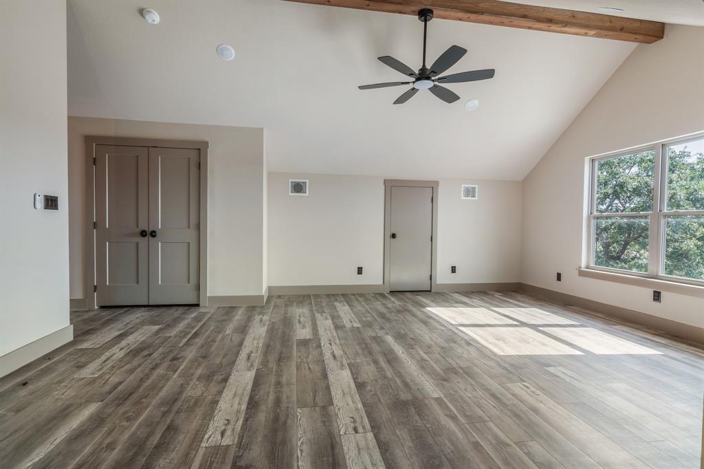 233 Jayden Lane Loving, TX 76460 - Photo 26 of 40 wooden floor in an empty room with a window