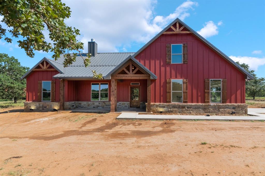 233 Jayden Lane Loving, TX 76460 - Photo 38 of 40 a front view of a house with a yard
