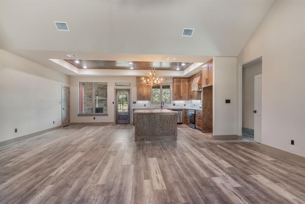 233 Jayden Lane Loving, TX 76460 - Photo 40 of 40 a kitchen with a sink and wooden floor