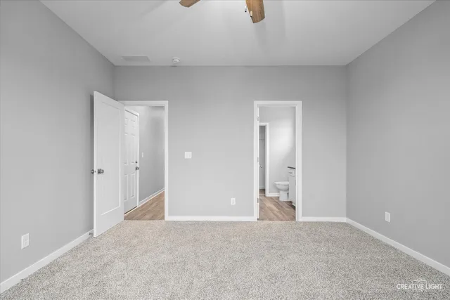 a view of an empty room and a window