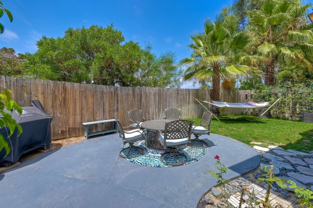 2425-27 Torrejon Place Carlsbad, CA 92009 - Photo 21 of 61 a view of a chairs and table in backyard of the house