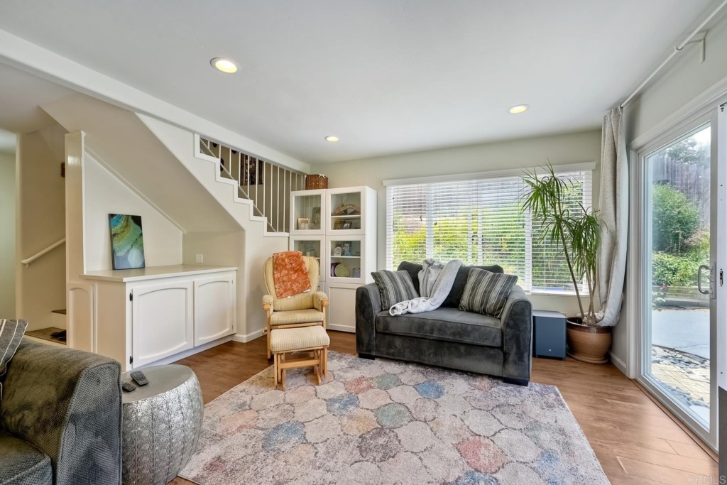 2425-27 Torrejon Place Carlsbad, CA 92009 - Photo 28 of 61 a living room with furniture and a large window