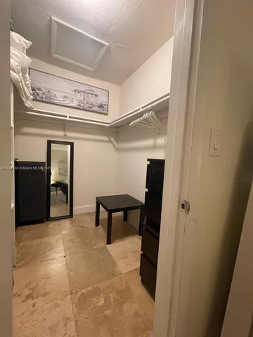 a view of a hallway with seating area