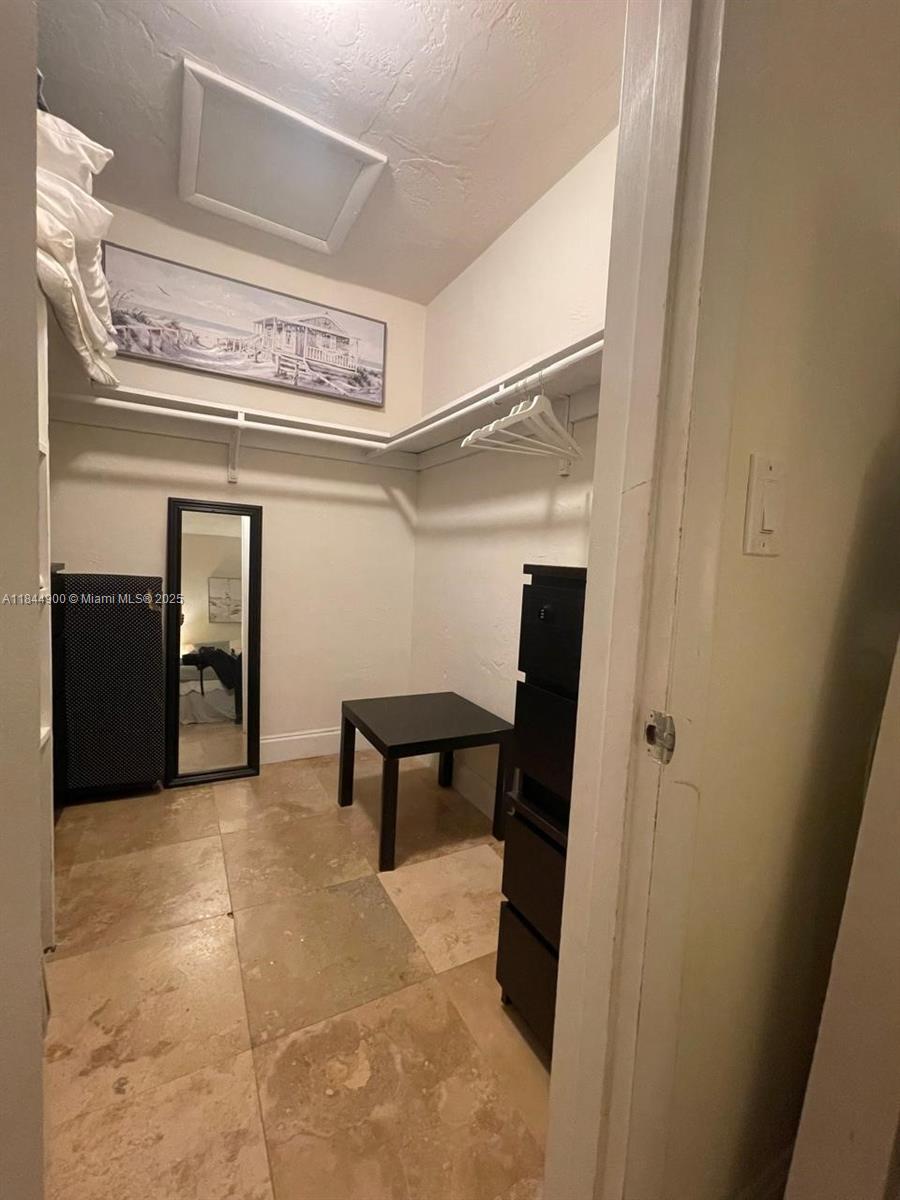 100 Sunrise Drive, Unit 27 Key Biscayne, FL 33149 - Photo 15 of 24 a view of a hallway with seating area