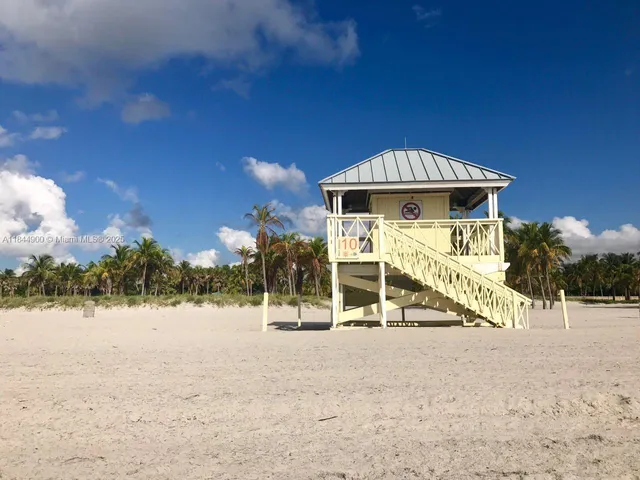 a view of a house with a wooden deck