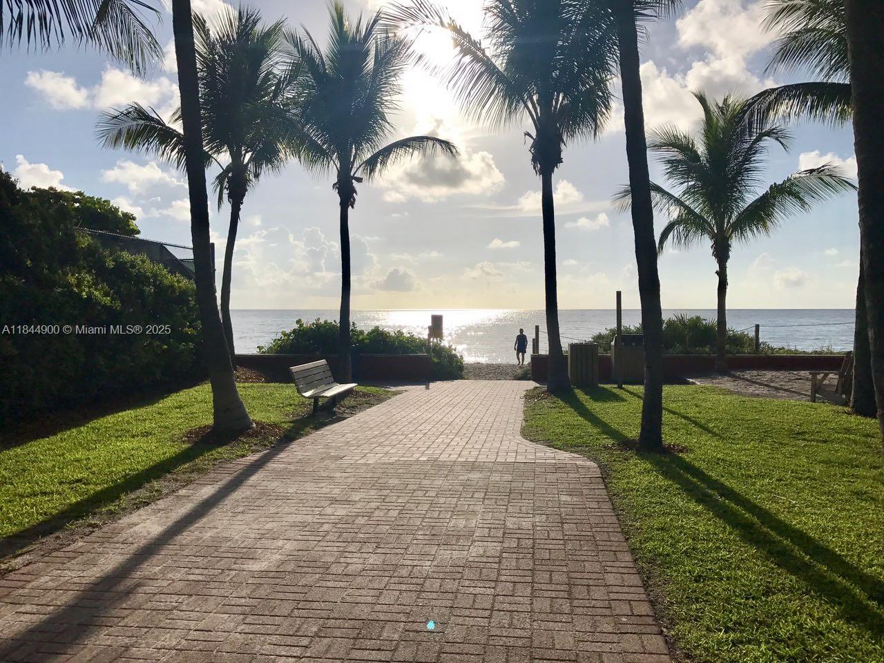 100 Sunrise Drive, Unit 27 Key Biscayne, FL 33149 - Photo 22 of 24 a view of a yard with palm trees