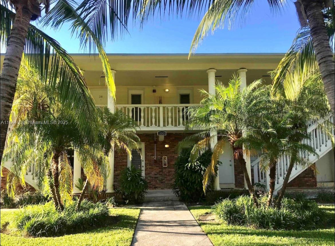 100 Sunrise Drive, Unit 27 Key Biscayne, FL 33149 - Photo 24 of 24 a front view of a house having yard