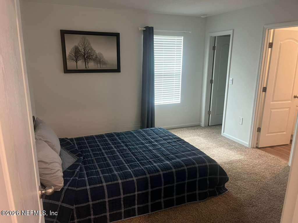 1685 Bridger Trace Middleburg, FL 32068 - Photo 11 of 13 a bedroom with a bed and a window