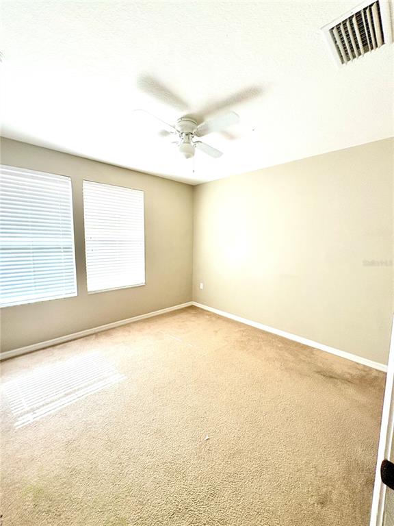 10812 Kensington Park Avenue Riverview, FL 33578 - Photo 11 of 20 an empty room with a window