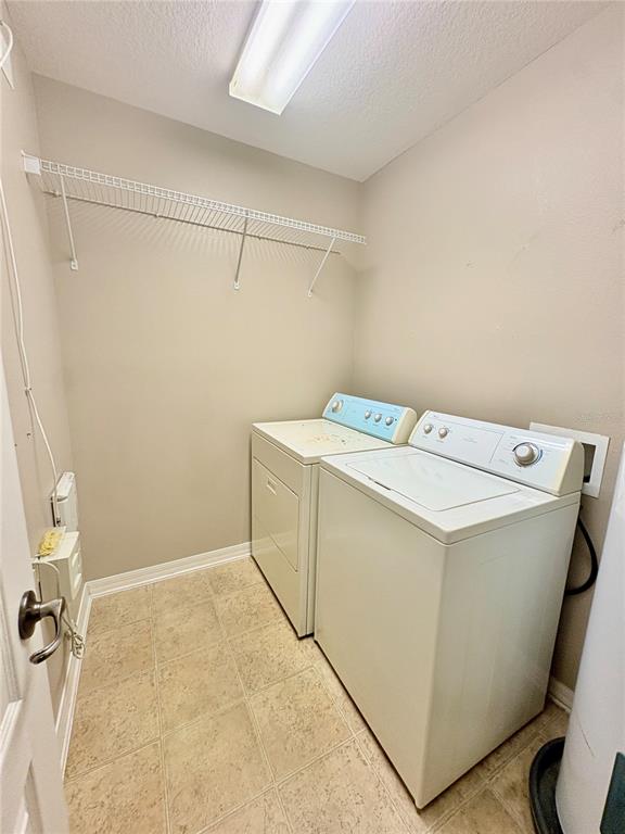 10812 Kensington Park Avenue Riverview, FL 33578 - Photo 15 of 20 a utility room with dryer and washer