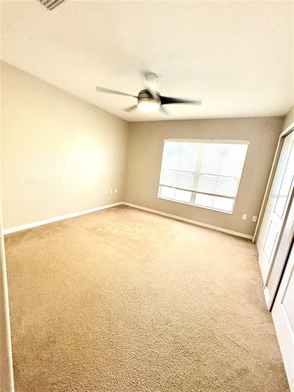 10812 Kensington Park Avenue Riverview, FL 33578 - Photo 16 of 20 a view of an empty room and window