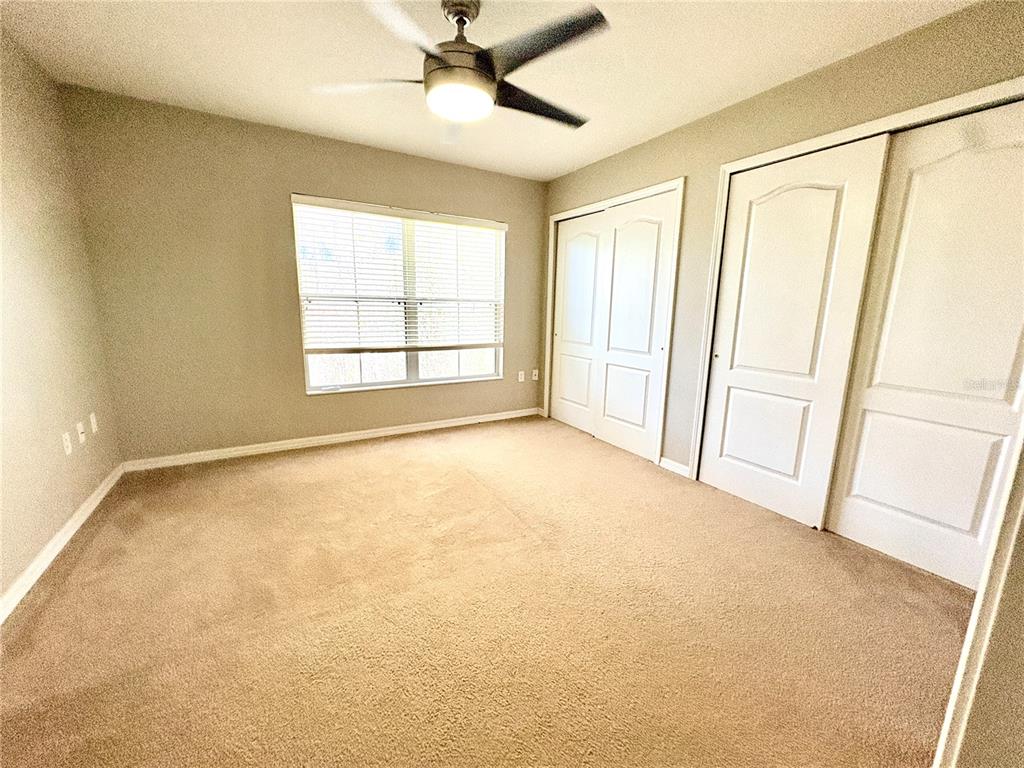 10812 Kensington Park Avenue Riverview, FL 33578 - Photo 17 of 20 a view of an empty room with a window