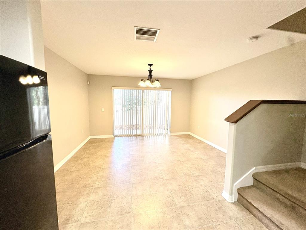 10812 Kensington Park Avenue Riverview, FL 33578 - Photo 7 of 20 a view of empty room with wooden floor and fan