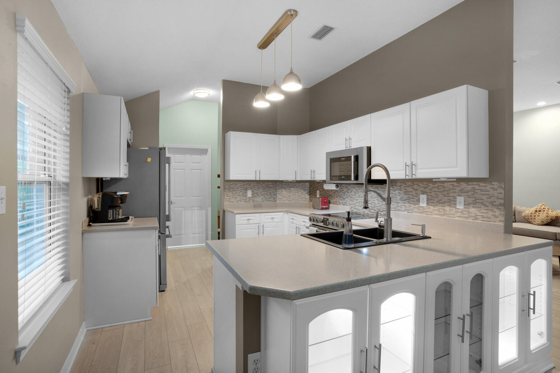 375 Bay Tree Drive Miramar Beach, FL 32550 - Photo 11 of 31 a kitchen with a sink a counter space cabinets and appliances