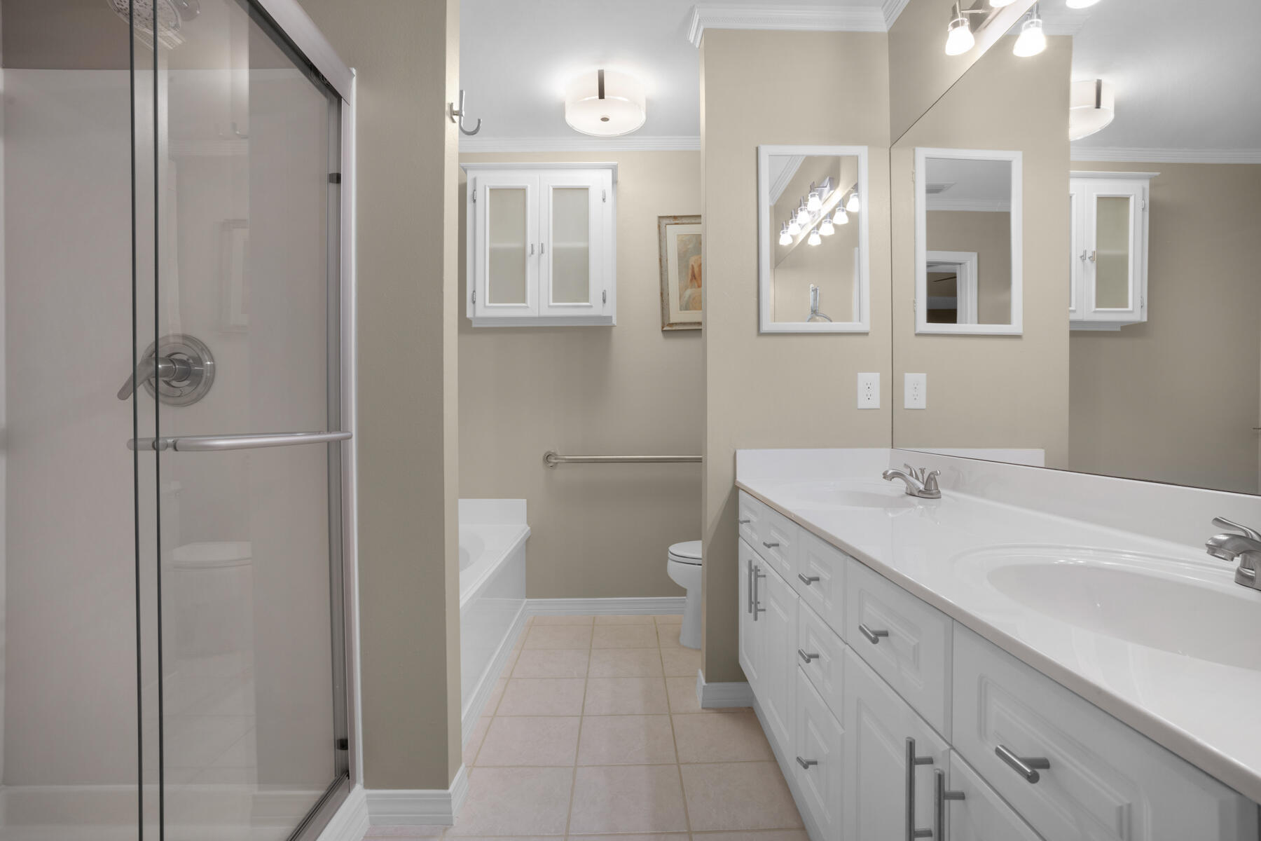 375 Bay Tree Drive Miramar Beach, FL 32550 - Photo 19 of 31 a spacious bathroom with a double vanity sink a large mirror and a shower