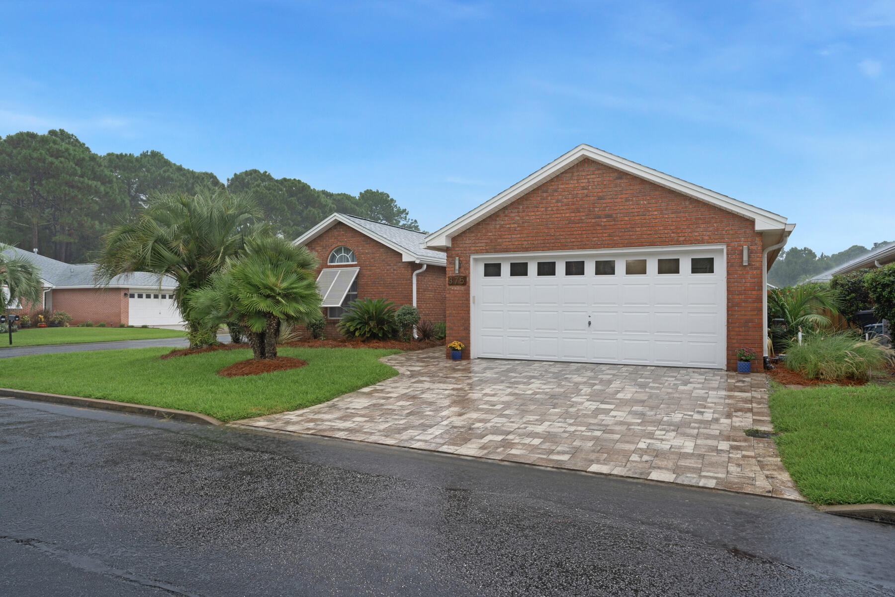 375 Bay Tree Drive Miramar Beach, FL 32550 - Photo 3 of 31 a front view of a house with a yard and garage