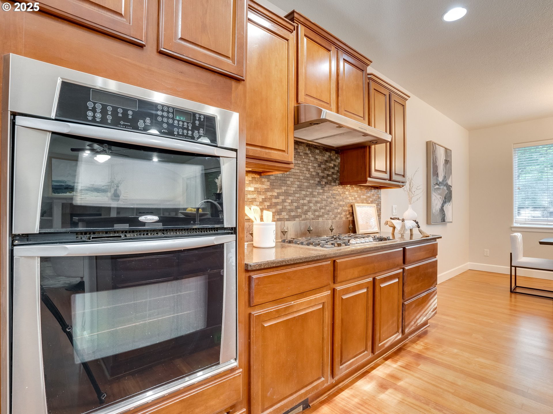 1308 Southeast 193rd Place Camas, WA 98607 - Photo 17 of 33 a kitchen with stainless steel appliances granite countertop a stove and a microwave