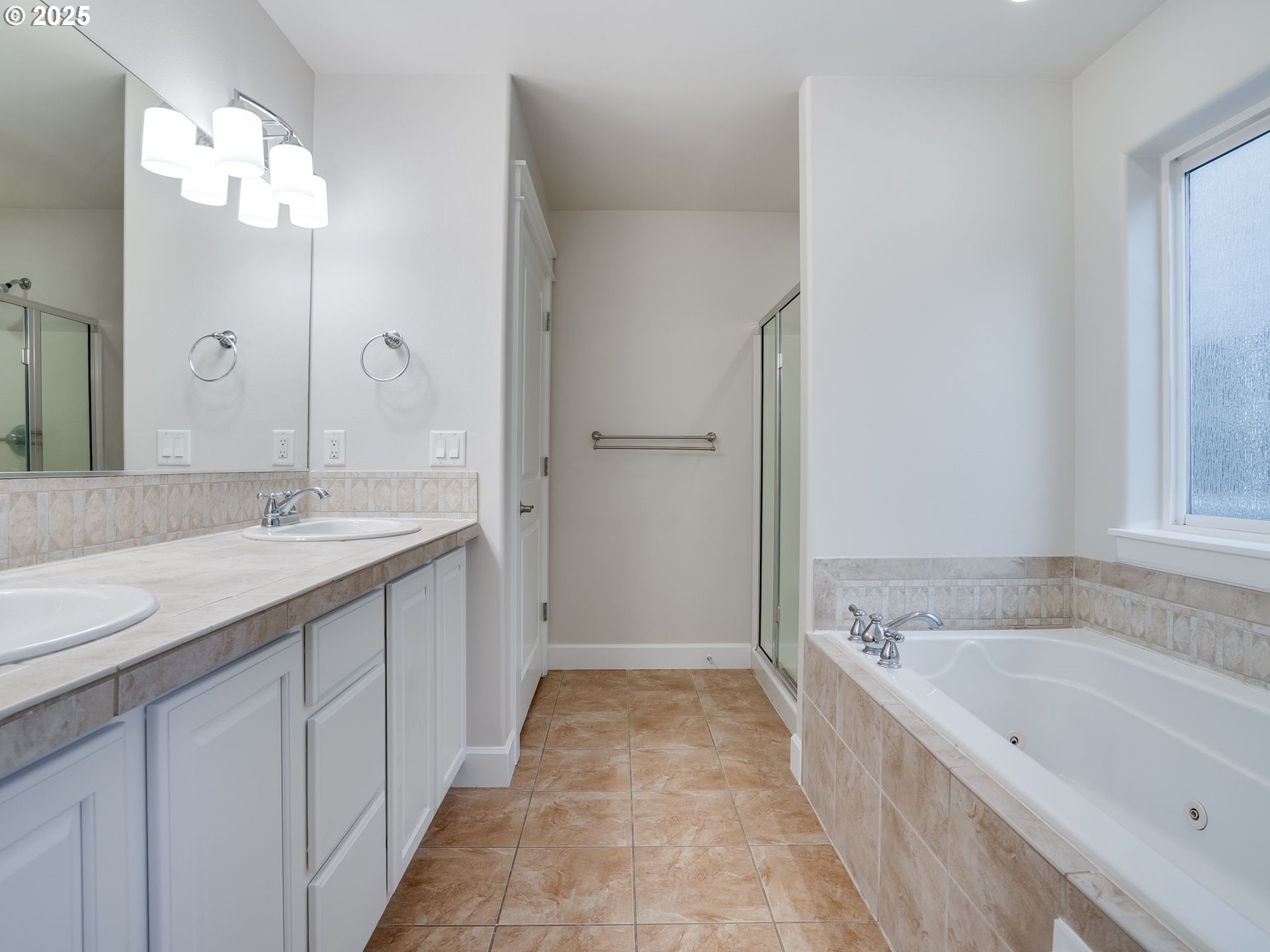 1308 Southeast 193rd Place Camas, WA 98607 - Photo 25 of 33 a spacious bathroom with a tub sink and mirror