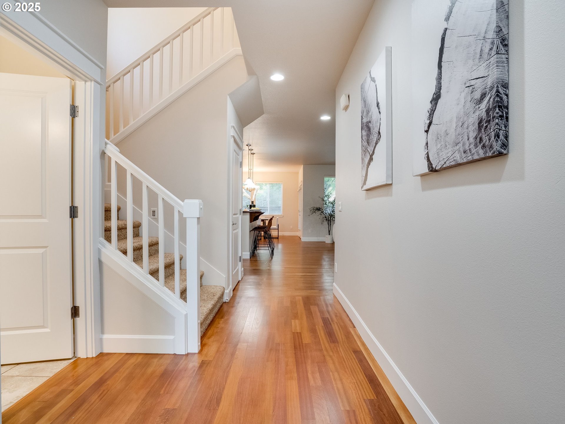 1308 Southeast 193rd Place Camas, WA 98607 - Photo 3 of 33 a view of a hallway with wooden floor and staircase